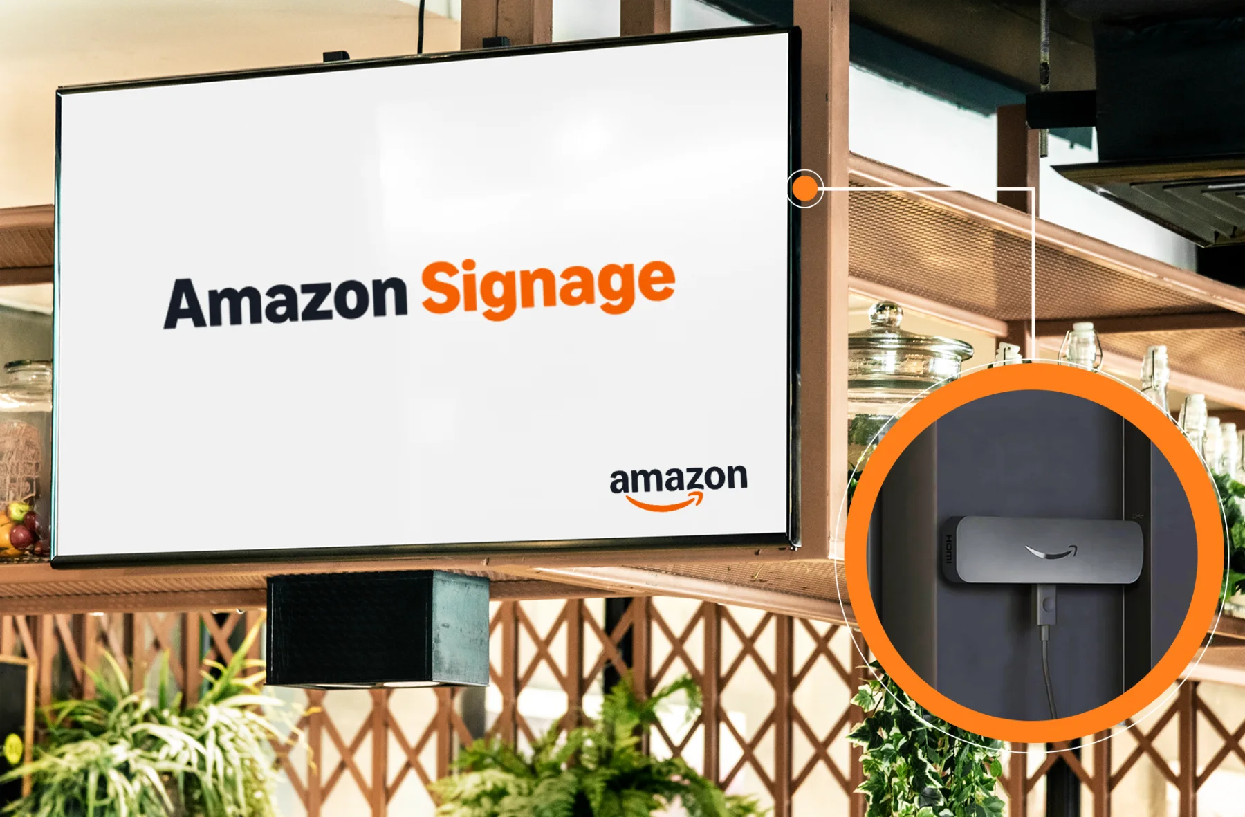 Bildschirm in einem Café, dahinter der Amazon Signage Stick im HDMI-Anschluss